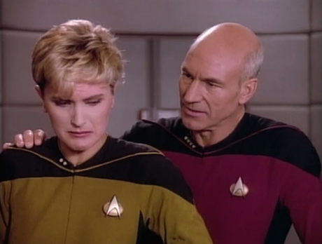 Captain Picard comforts Lieutenant Yar in her penalty box.