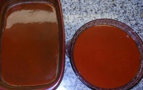 I prepped my 9x13 casserole dish by pouring a little enchilada sauce in the bottom of the pan, then I poured the remaining sauce into a pie tin.  I find it is the perfect size and shape for dipping the tortillas in the sauce.