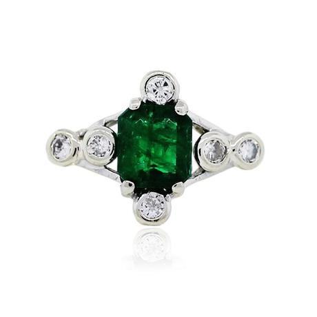 Emerald and diamond engagement ring