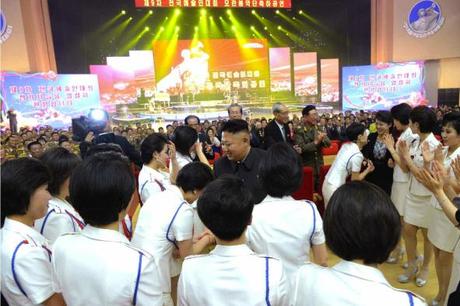 Kim Jong Un shakes hands with members of Moranbong Band after their concert (Photo: Rodong Sinmun).