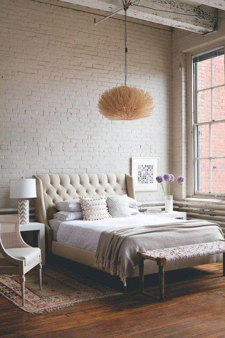 tufted headboard...getting one of these in the future! and love the simplicity of the exposed brick and wood floors with large windows...id love that