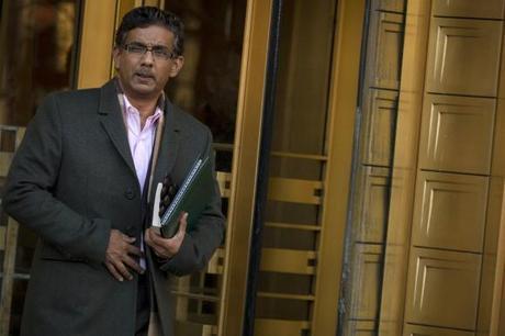 Conservative commentator and best-selling author, Dinesh D'Souza exits the Manhattan Federal Courthouse in New York, January 24, 2014. REUTERS/Brendan McDermid