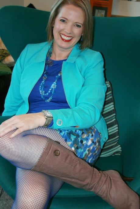 Wearing a blue fishnet tight with a light rose brown boot.  