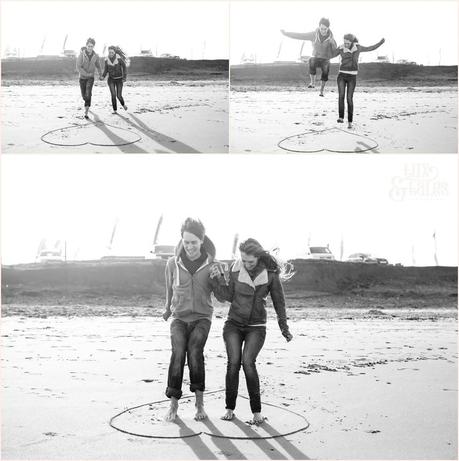 couple laughing and jumping at yorkshire beach engagement shoot at Fraisthorpe beach