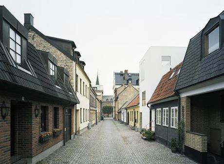 modern block on old street