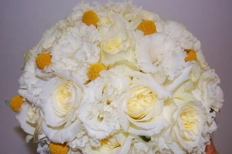 White wedding flowers enhanced by yellow flowers