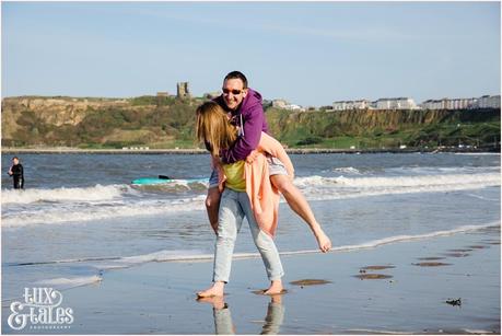 funny piggyback ride in Scarborough engagement shoot