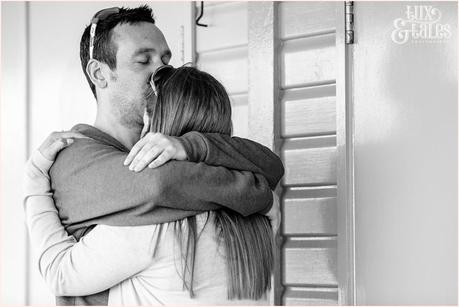 Scarborough engagement shoot with couple cuddling at beach huts