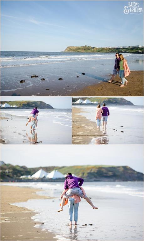 Couple playing in the ocean in North Beach in Scarborough