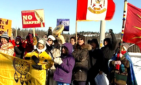 Idle No More demonstrators protest in the middle of the street, closing part of the TransCanada highway in Northern Ont.