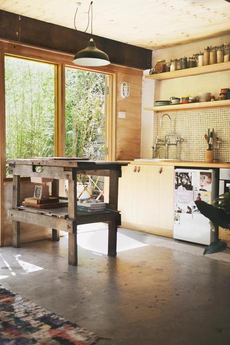 Kitchen area. Love the worn look of the workbench