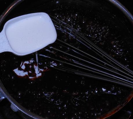 I turned the heat back on to medium high.  When the syrup started the simmer, I gradually added 3 tablespoons of heavy whipping cream, stirring with a whisk until it was incorporated.