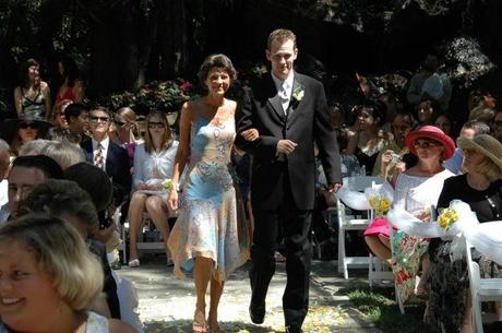 Mother walking son down the aisle