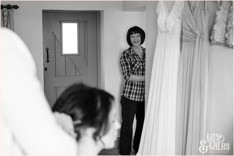 Brides mother watches bride have makeup applied at The Ashes