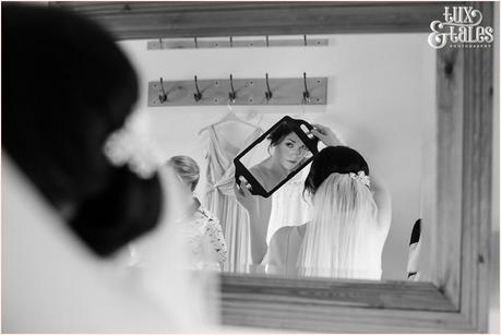 Bride looks at ehr reflection at the ashes