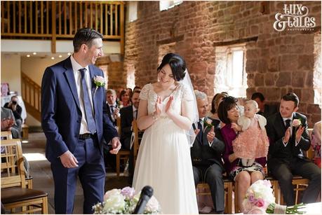 bride claps after first kiss at The Ashes wedding
