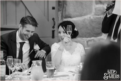 Bride raises a toast at the ashes wedding