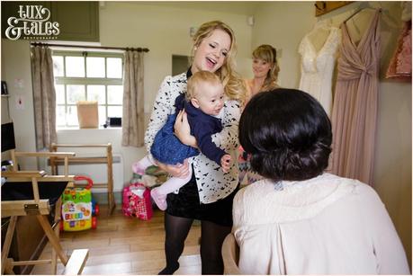 Bride is shown her baby daugher as she gets ready for wedding