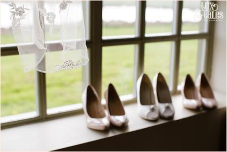 Wedding photography of shoes in window at The Ashes