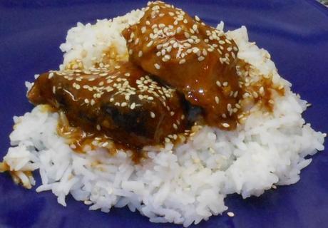 I served the Honey Sesame Chicken over Jasmine Rice and sprinkled some sesame seeds on top for fun.  It was delicious!