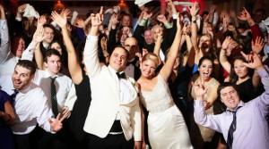 happy bride and groom dancing