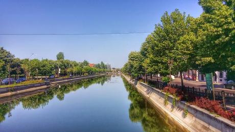 Canal in the middle of the city provides a refuge for locals.  We even saw someone fishing in it!