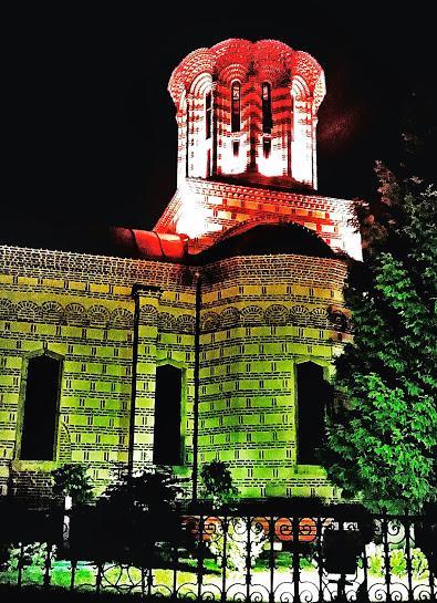 Church lit up at night.