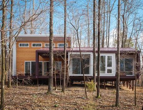 modern green arkansas cabin cement panels facade