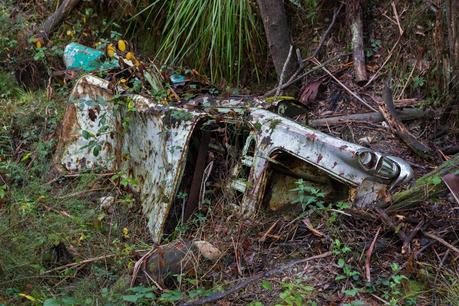 abandoned wrecked car in ditch