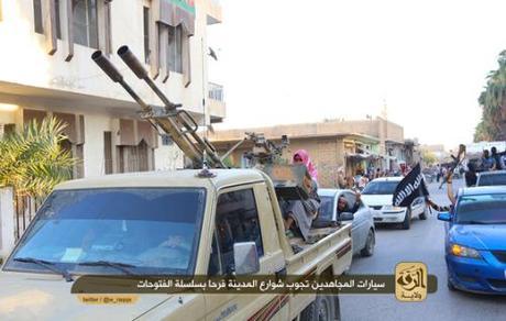 Photo from a jihadi forum shows ISIS forces parading through a city.