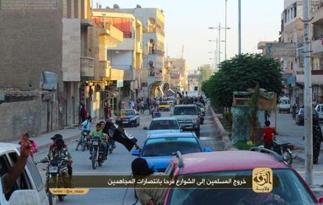Found on a jihadi forum, this photo shows civilians coming out to greet the ISIS forces.
