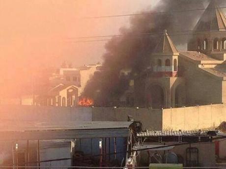 Church in Mosul in flames after ISIS set it on fire. :(