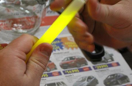 Activating the Glow Stick before cutting the top off it.