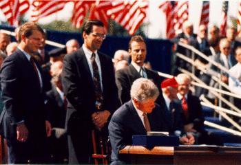 English: President Bill Clinton signing the No...