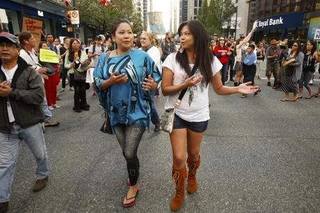 Squaimish sisters Amanda and Marissa Nahanee street dancing during anti-Enbridge rally Tuesday evening in downtown Vancouver - Mychaylo Prystupa
