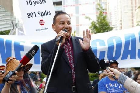 Union of B.C. Indian Chiefs Grand Chief Stewart Phillip smiling to the crowds gathered outside CBC Vancouver for a rally, following the federal decision approving the Northern Gateway pipeline on Tuesday - photo by Mychaylo Prystupa