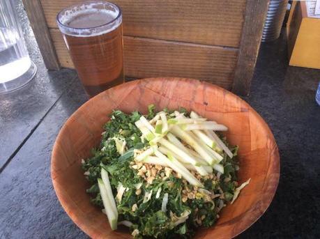 Kale Salad with julienned cabbage, green apple, cilantro, scallions, roasted peanut vinaigrette, and fresh peanuts.