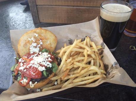 Fun Guy Burger: grilled portabello patty topped with goat cheese, arugula, roasted tomatoes, & garlic mayo