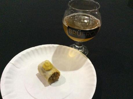 Vegan barley sausage wrapped in a buttermilk biscuit, served with spicy mustard by WaterCourse Foods, with Fruhling, Zwickel Maibock from Renegade Brewing