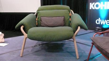 Modern wood-framed chair with green cushion by Stephen Burks
