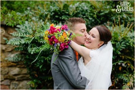 Yorkshire wedding photography groom kisses bride on the cheek