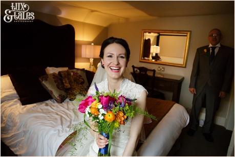 Bride smiles as she gets ready  for her wedding