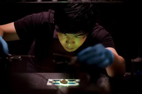 Jaesang Lee, Electrical Engineering PhD Student and member of the Stephen Forrest's Optoelectronic Components and Materials Laboratory, tests a light concentrating LED