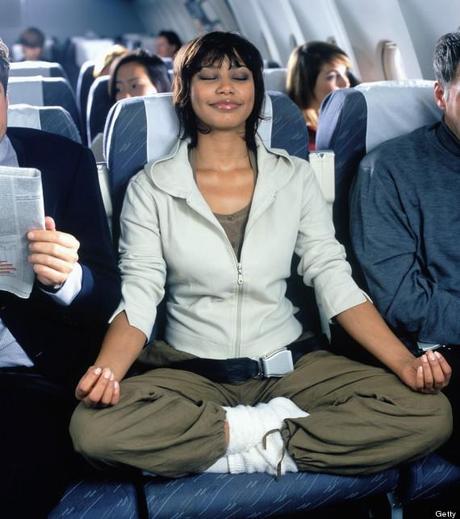 5 yoga poses you can try on an Airplane