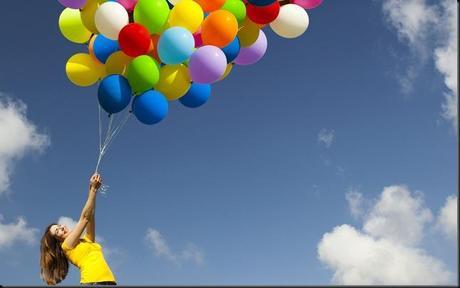 Holding baloons