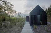 Blackened Timber Cottages by Format Elf Architekten