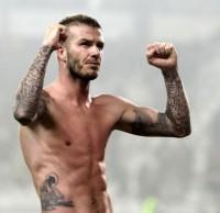 AC Milan Beckham celebrates at the end of the match against Juventus during their Serie A soccer match at Olympic stadium in Turin