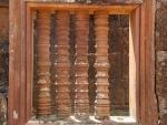 Carved column windows mimicking lathed wood