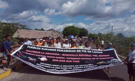 The Kukama march to the city of Iquitos to protest against toxic waste left behind by more than 40 years of oil contamination in their territories. Photograph: Deborah Rivett/The Arkana Alliance