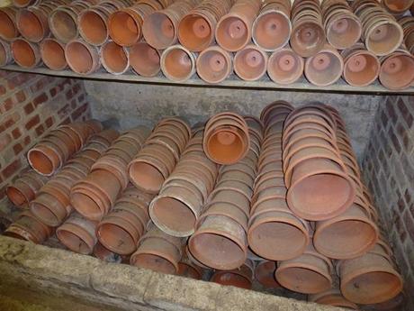 very neatly stacked pots in a garden shed